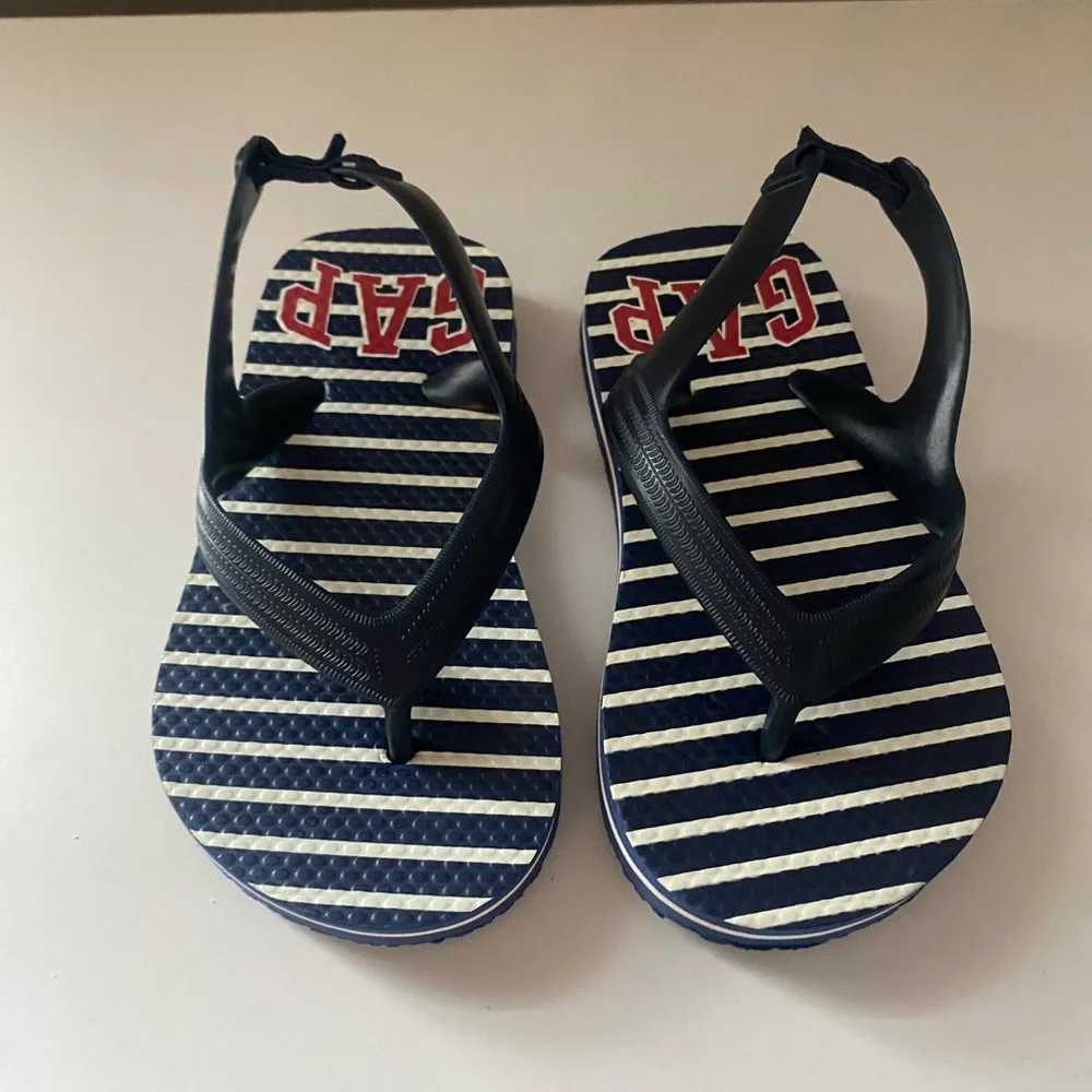 2 pairs Gap flip flops sz 10. NWOT blue/white striped. NWT neon orange striped.